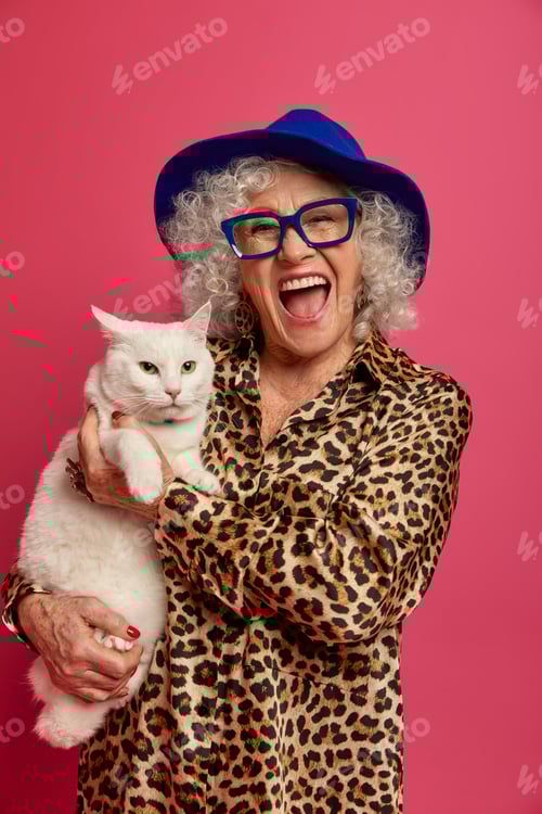 Preview: Positive carefree fashionable granny poses with domestic white cat, going to vet, spend free time to