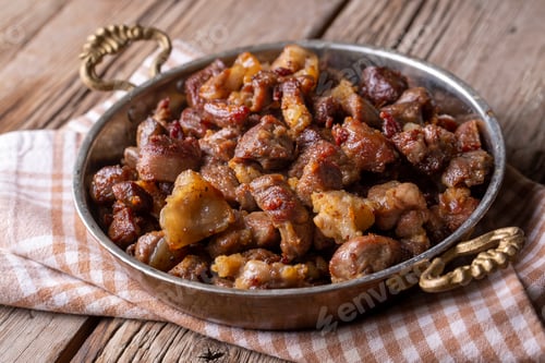 Preview: Turkish roasted meat in copper pot on table top. Turkish Kavurma. (Turkish name; Kurban kavurma)