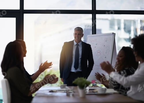 Preview: Shot of a team of silhouetted businesspeople attending a meeting in the boardroom
