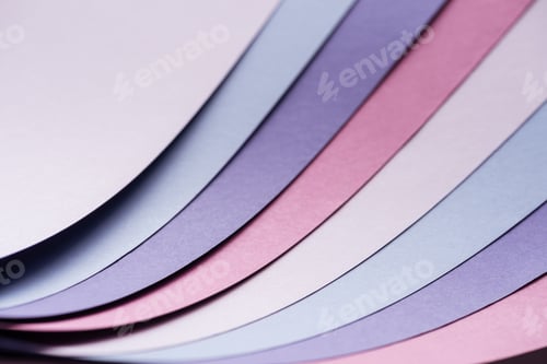 Preview: colorful blue, white, pink and purple sheets of paper with copy space