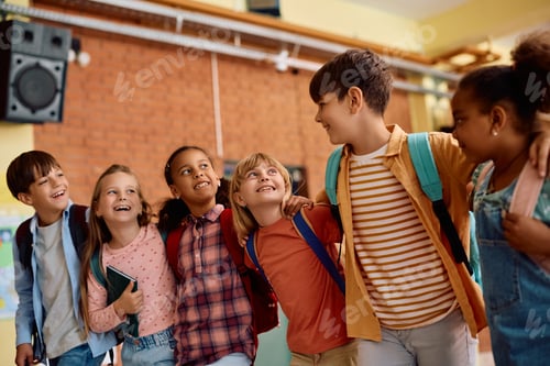 Preview: Group of happy diverse school kids standing embraced in a hallway.