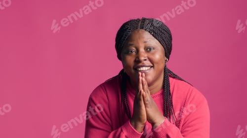 Preview: Woman pleading with her hands together