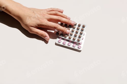Preview: Woman Hand Selecting Contraception Pill Blister Pack. Medical Concept for Reproductive Health