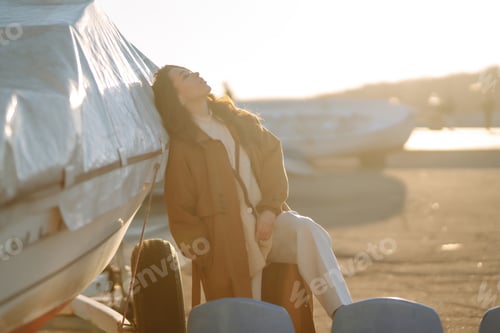 Preview: Stylish woman enjoying autumn weather outdoor. Fashion, style concept. People, lifestyle, relaxation
