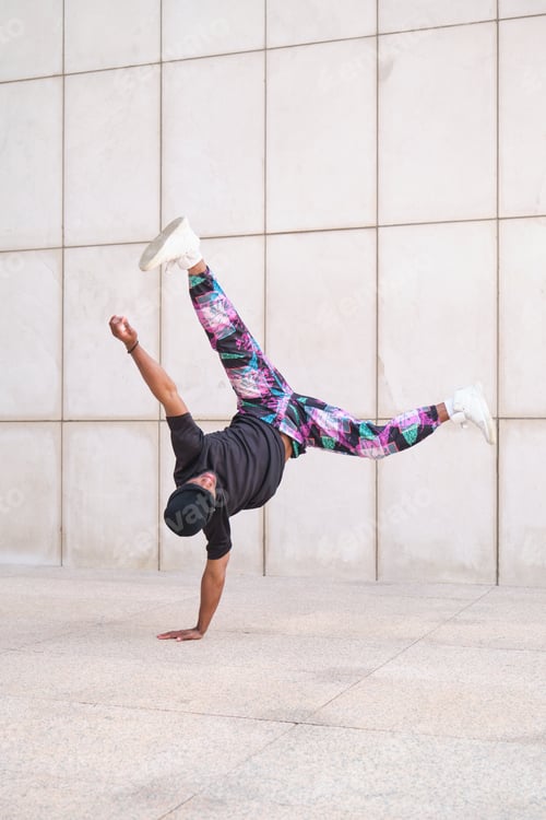 Preview: Young man breakdancing upside down on one hand