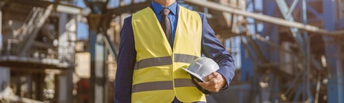 Preview: Male worker standing outdoors at production plant