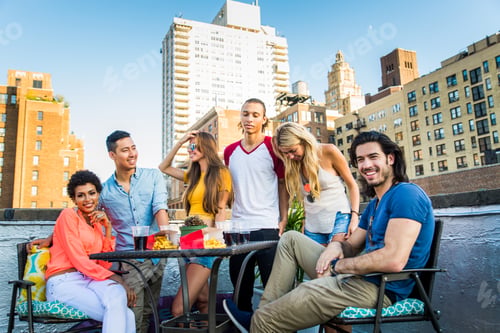 Preview: Group of friends having party on a rooftop