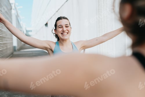 Preview: Young women doing some marked exercises outside the home, jumping and exercising their muscles.