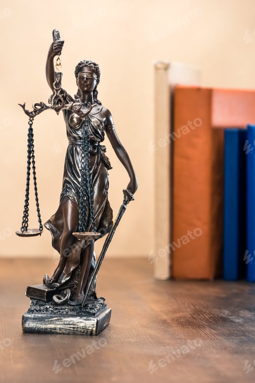 Preview: Close-up view of statue of lady justice on wooden table, Law concept