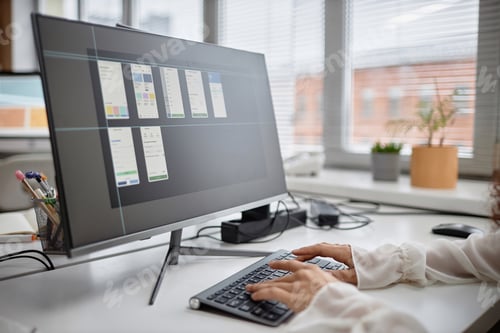 Preview: Woman Working on Computer Developing Mobile Application