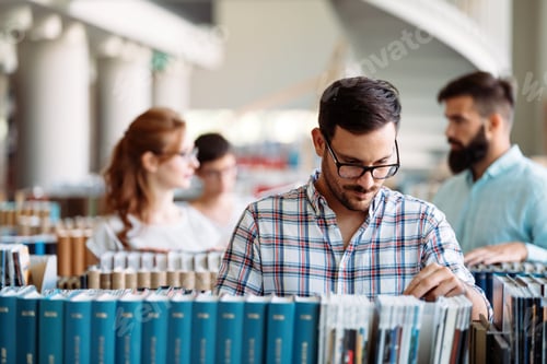 Preview: Portrait of young male student in library