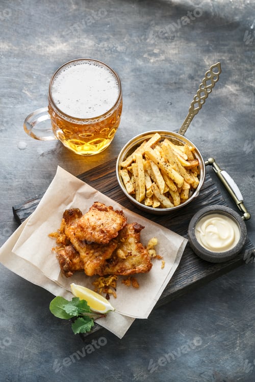 Preview: British Fish and chips with beer on dark background