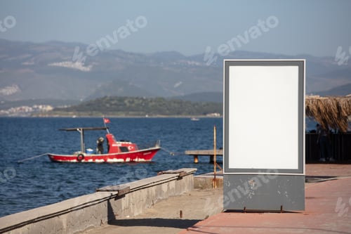 Preview: Landscape shot of advertisement stand in front of a lake