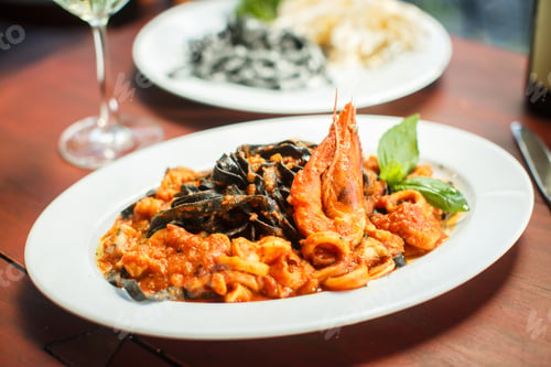 Preview: Traditional Italian dish - black tagliatelle with seafood