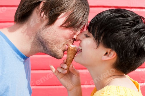 Preview: Couple sharing a playful moment with a snack