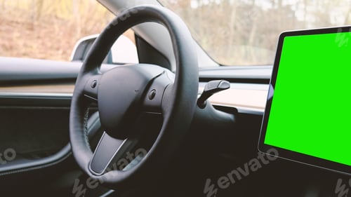 Preview: Interior dashboard with a modern interface design and steering wheel. Green screen chromakey