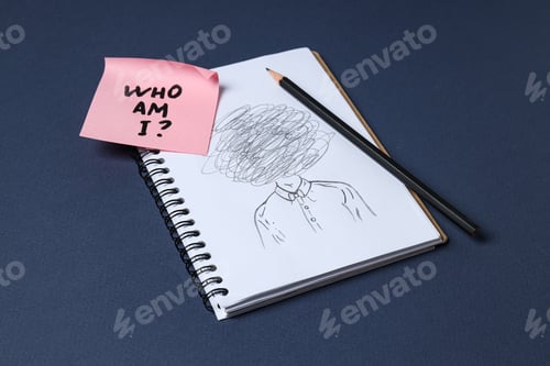 Preview: Notepad with pencil drawing and pink note with text on dark blue background