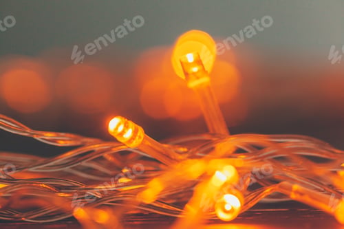 Preview: Illuminated garland close up on dark background