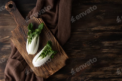 Preview: Leafy cabbage bok choy on a cutting board, healthy green vegetables.