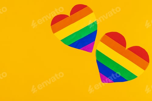 Vista previa: Rainbow paper heart on paper background top view