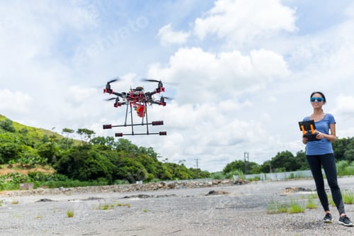 Preview: Woman remote the drone at outdoor