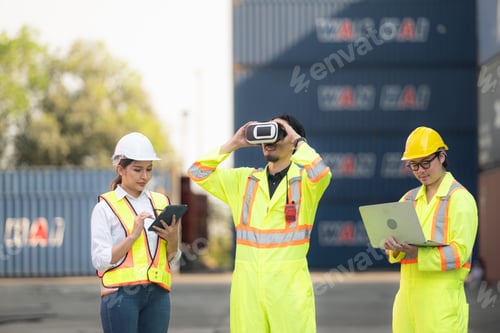 Preview: Engineers and laborers utilize VR headsets to control work in a container warehouse.