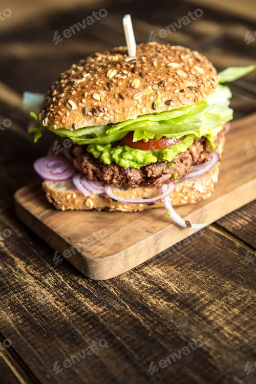 Preview: Vegetarian Burger with beetroot patty, avocado cream, salad and onions