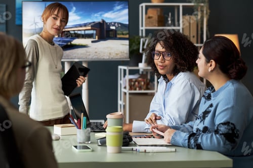 Preview: Female Team Discussing New Project At Meeting
