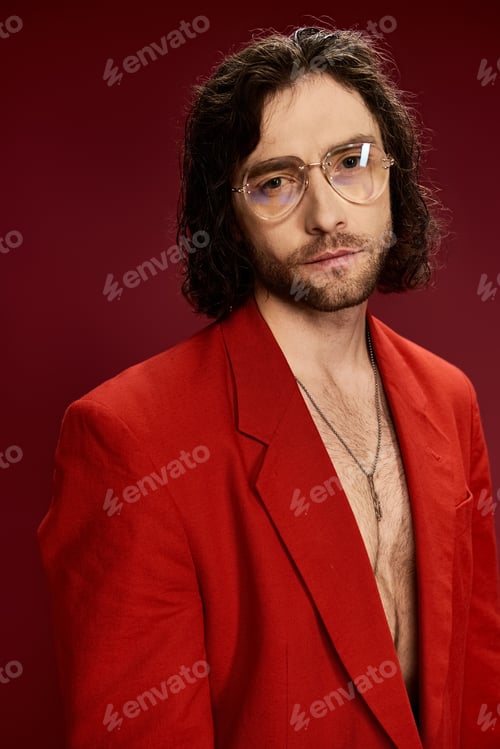 Preview: Stylish visionary: man in red suit and glasses
