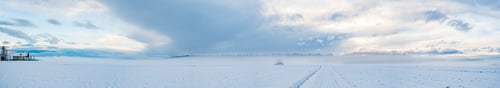Preview: Panorama of agriculture fields covered with snow and fog in winter