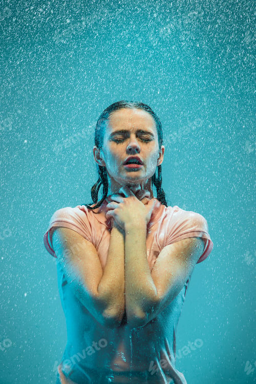 Preview: The portrait of young beautiful woman in the rain
