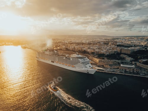 Preview: A cruise ship on the dock at sunset