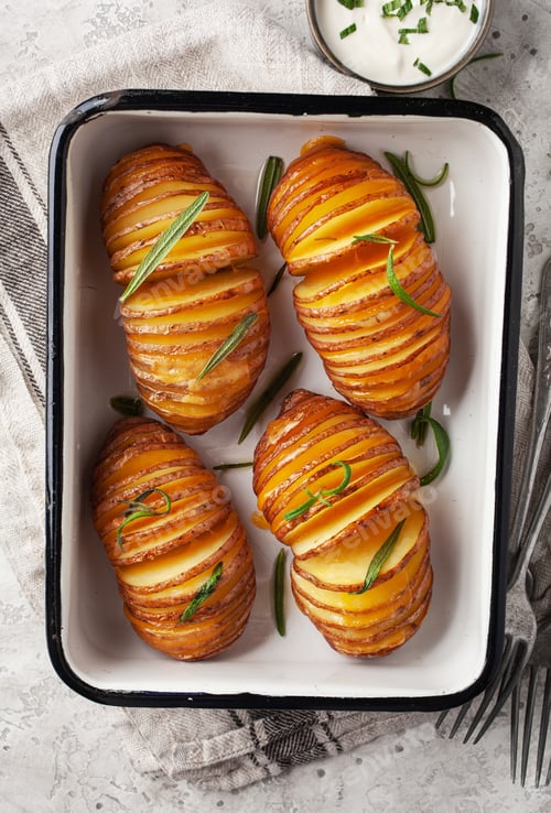 Preview: baked hasselback potato with cheddar cheese and rosemary