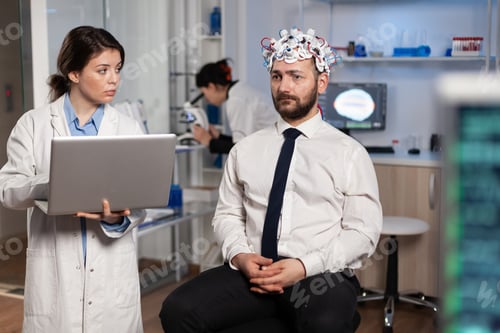 Preview: Researcher woman doctor typing neurological disease symptoms on laptop