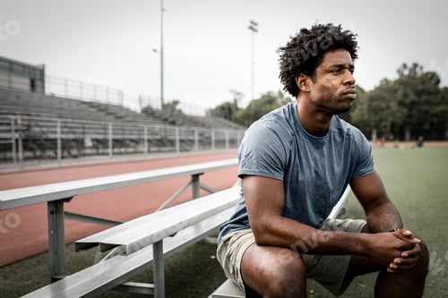Preview: Man sitting by the stadium