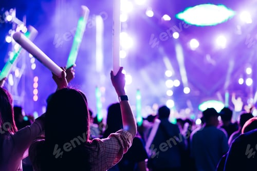 Preview: Crowd of concert stage lights and people fan audience silhouette raising hands or glow stick holding