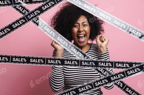 Preview: Excited african american girl making winner gesture and screaming