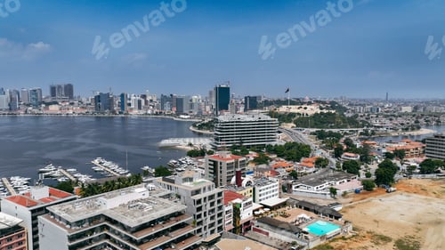 Preview: Aerial view of Luanda\'s vibrant waterfront and urban landscape in Angola on a clear day