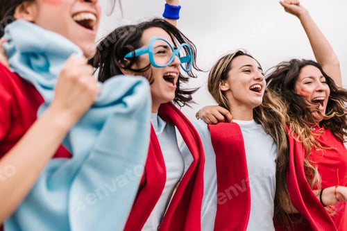 Preview: Excited multi generational women football fans supporting their team