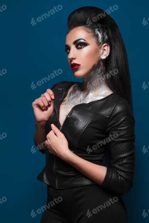 Preview: Girl With Creative Make-Up On A Blue Background