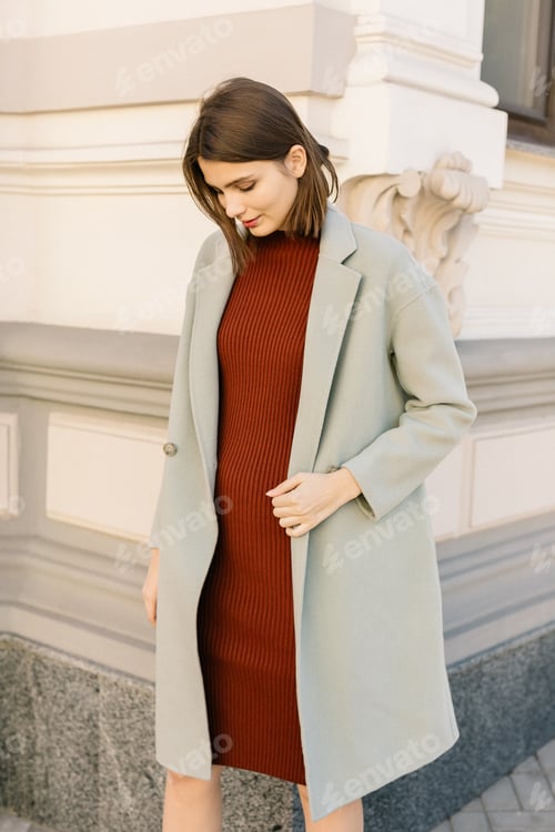Preview: Young beautiful stylish woman walking in street in autumn fancy outfit.