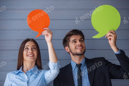 Preview: Beautiful business couple with speech bubbles