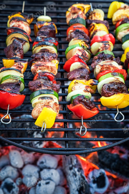 Preview: Skewers on grill with meat and vegetables on hot grill