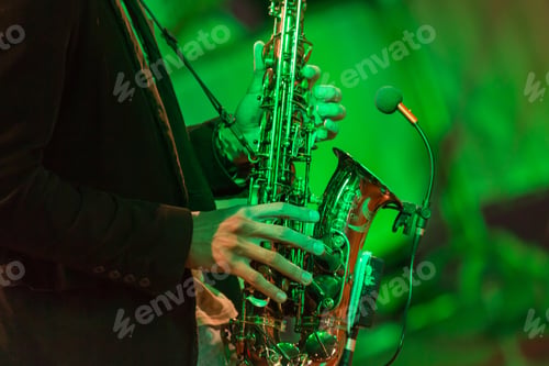 Preview: Man playing saxophone, hands in frame