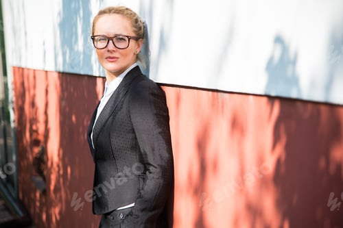 Preview: Girl In A Business Suit Standing Near The Building Where He Works