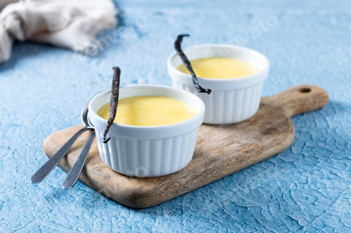 Preview: Homemade vanilla custard on blue background