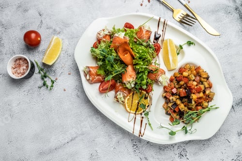 Preview: salad with vegetables, cheese and fresh salmon rolls. banner, menu, recipe place for text, top view