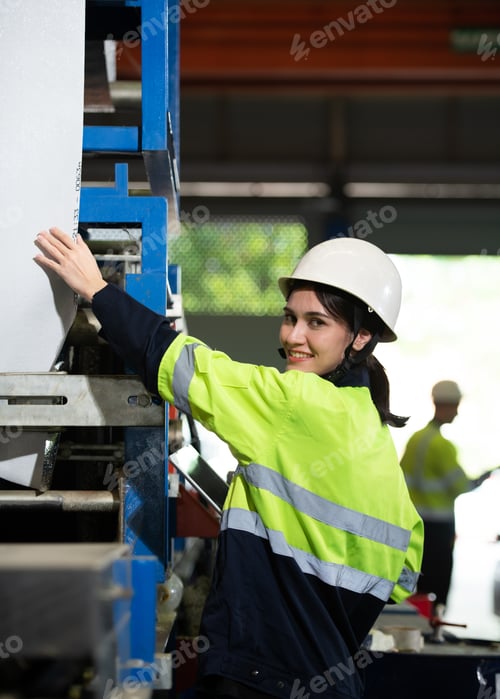 Preview: Portrait of a heavy equipment female engineer from a huge industry