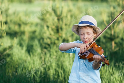 Preview: Boy playing violin outside classroom, child boy is playing the violin standing in park background