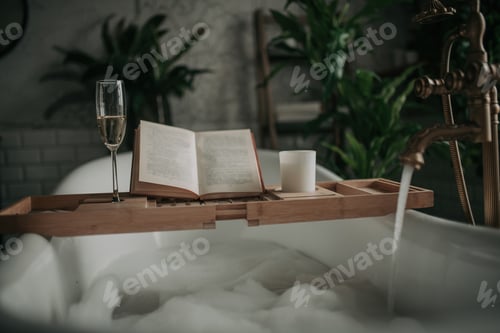 Preview: Luxury interior of eco style modern bathroom with oval bathtub and book on bamboo wood tray